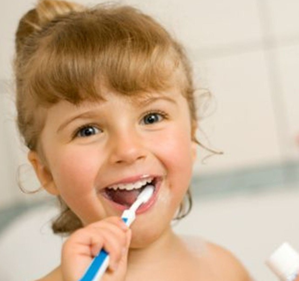 Girl brushing teeth